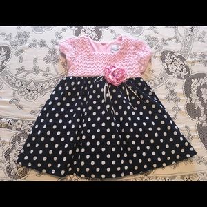 Pink, white, and navy polka dot dress